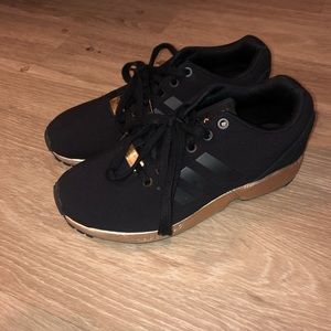 Black and gold adidas